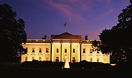 Illuminated White House at dusk