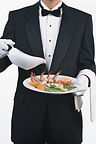 Waiter serving elegant seafood dish