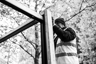 Rock maintenance engineer paul Smith adjusts a new Reynaers Aluminium door -