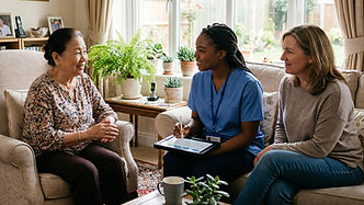 Caregiver consults with an older woman and another woman