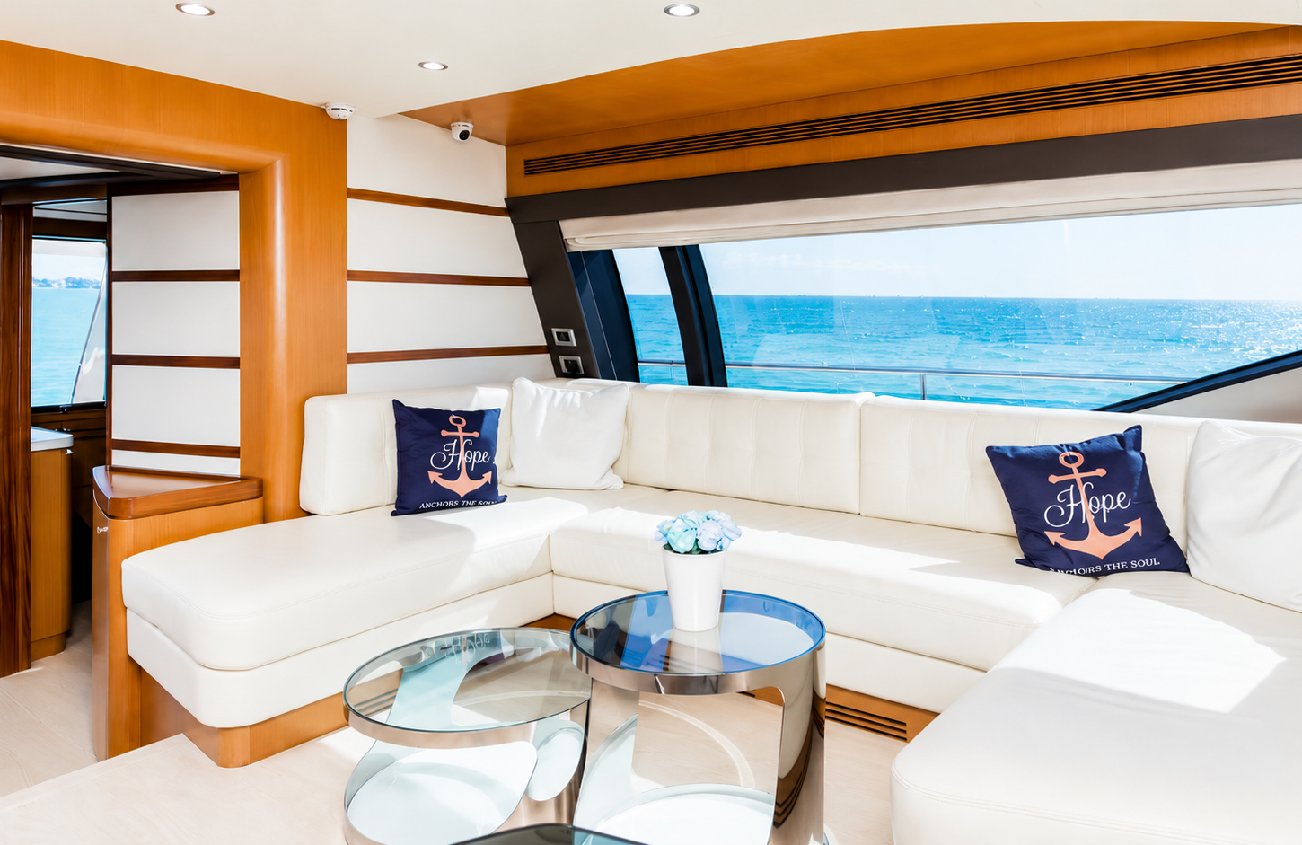 Modern salon of a Ferretti Flybridge 66 with sea views