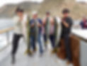 Four women proudly display their yellowtail catches