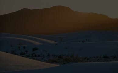 Golden sunlight spills over the distant
