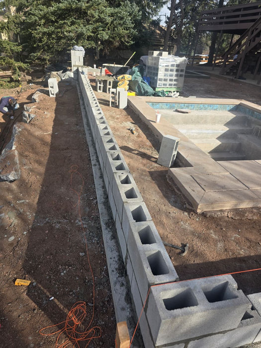 Cinder block retaining wall under construction