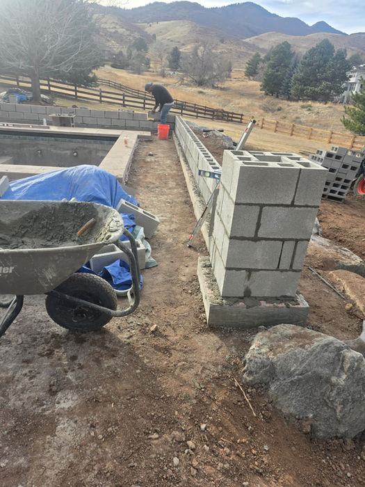 Cinder block wall construction at a mountain site