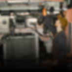 Technician inspecting truck engine at First Watch Service Center