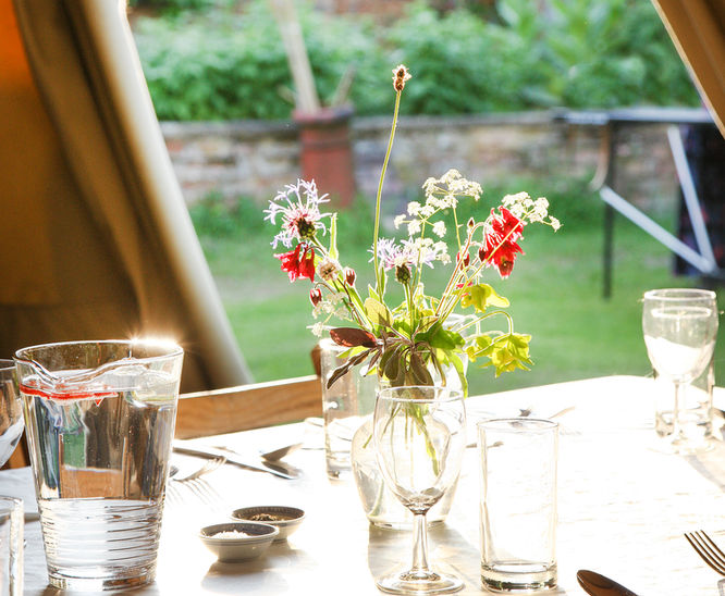 table setting in giant tipis at taltonlodge