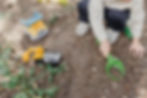 Child doing some gardening outside