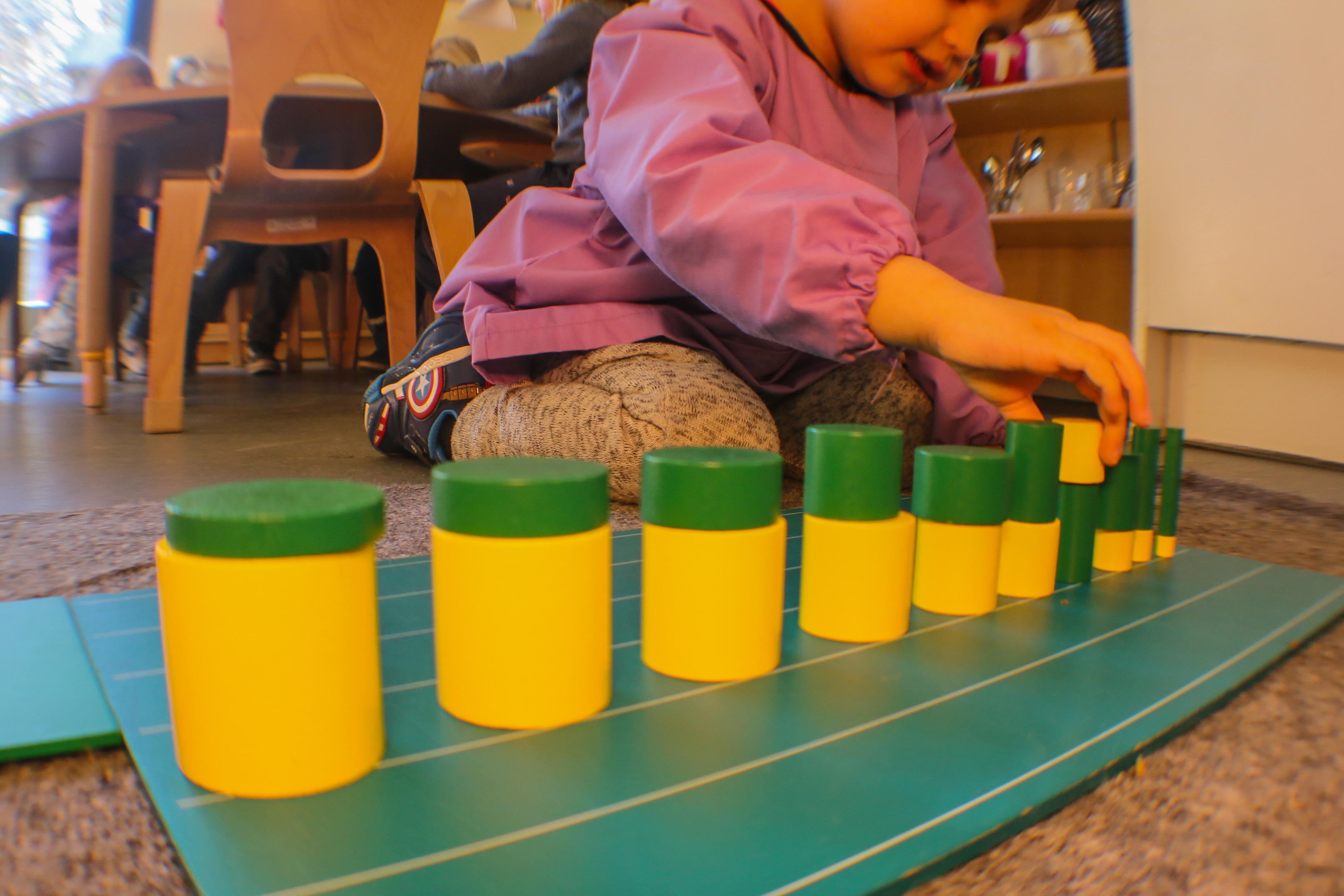 Child playing with coloured blocks
