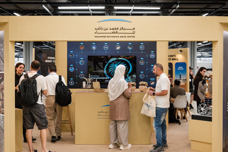 Wide view of visitors inside the MBRSC stand at COSPAR 2026