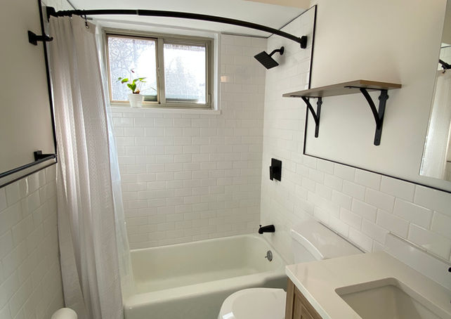 Bathroom with vintage tile floors, and wood vanity