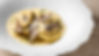 Sorrentini gevuld met paddenstoelen en verse truffel, met parmezaanse saus bij Alcomo in S