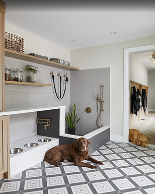 mudroom and custom dog wash station. Complete with integrated feeding stations, storage solutions, and durable finishes, the space demonstrates how luxury is often expressed through convenience and thoughtful planning rather than ornamentation.
