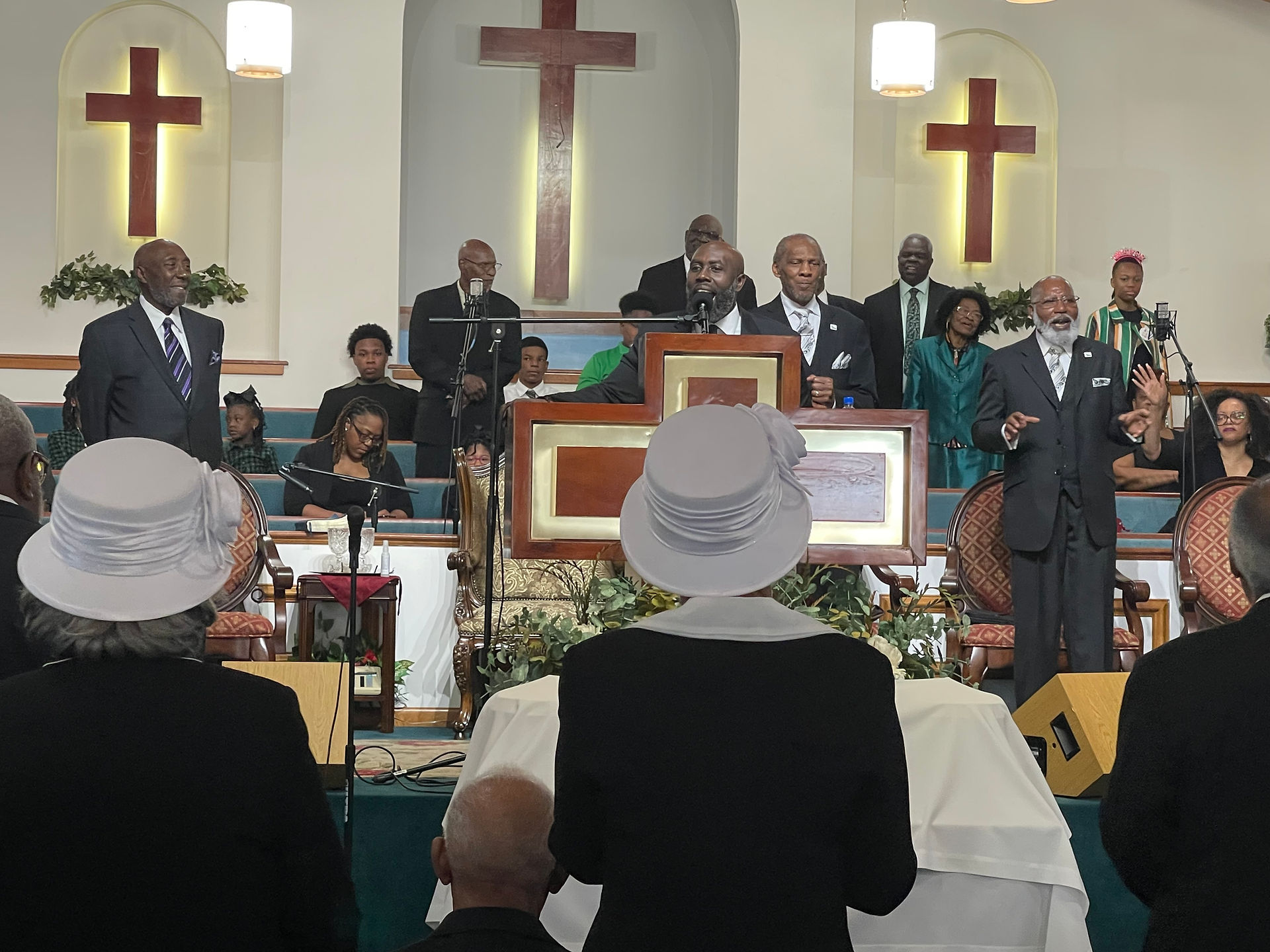 Pastor Thompson in pulpit preaching