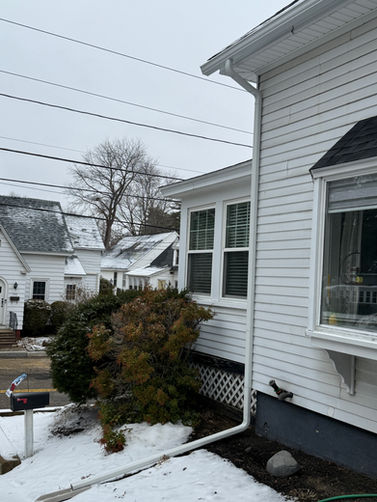 Downspout installation directing water away from a home's foundation