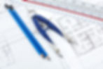 pencil and compass over a construction drawing.jpg
