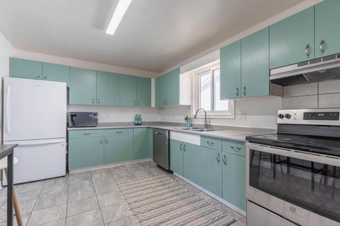 Spacious raised bungalow with 3+3 bedrooms and in-law suite capability in North Welland FOR SALE by The Kesh Group Niagara REALTOR Natalie Keshavarznia.
