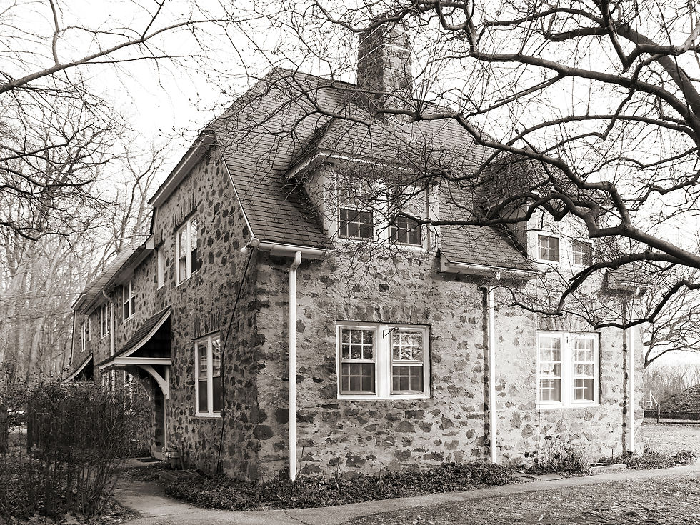 A historic photograph shows the original twin worker’s cottage.