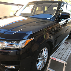 Black Range Rover undergoing multi-stage paint correction.