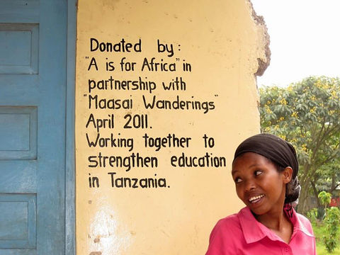 Girl in front of school