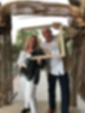 Jane Poston and her husband, Jason Heinkel in a picture frame at the Liberty Wildlife charity event.