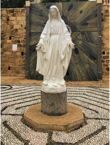 ....and statue of Our Lady, facing a waterfall.