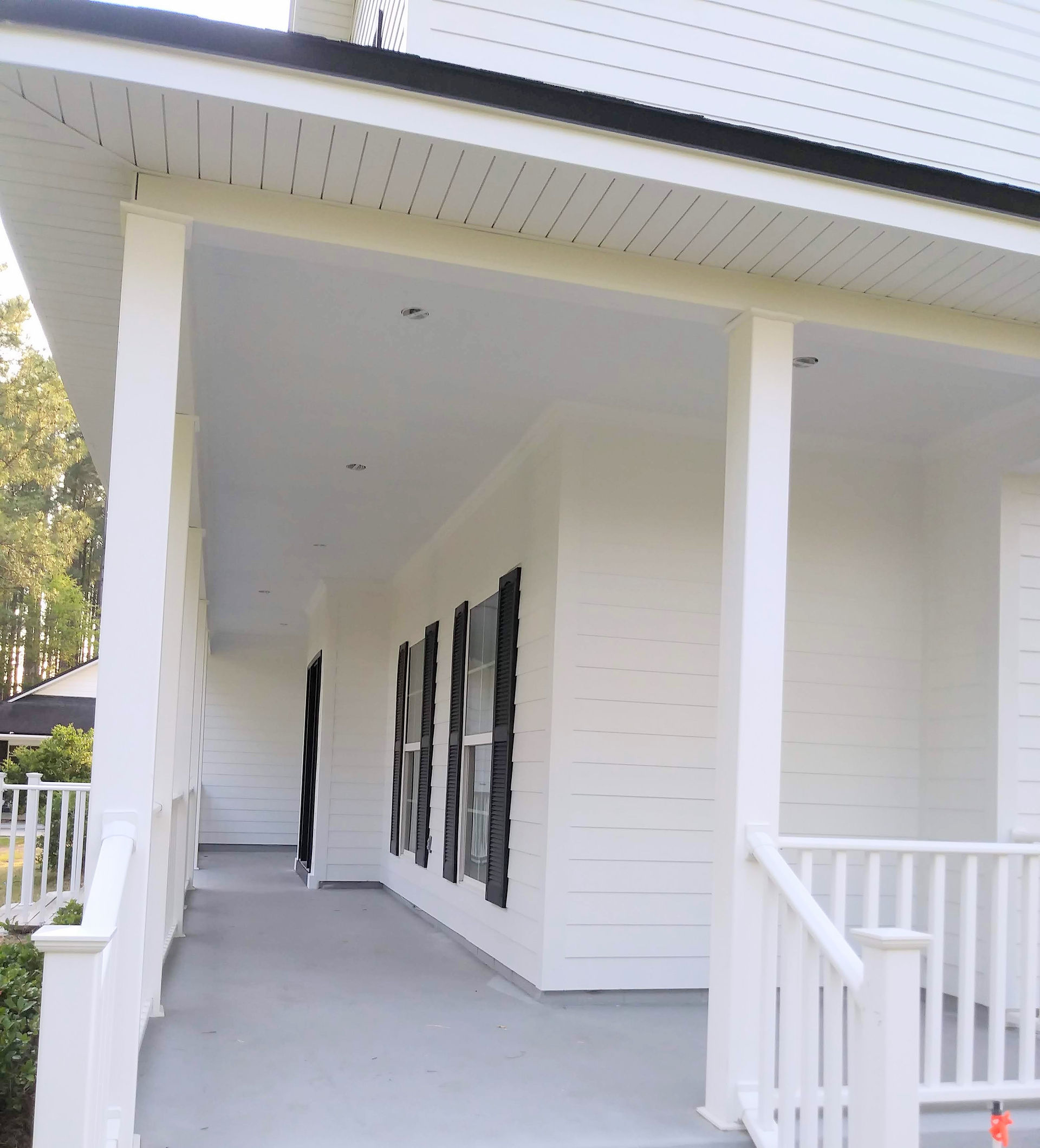 Exterior white house painting wood repair