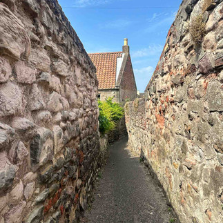 A narrow walkway between stone walls