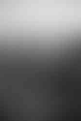 Couple embracing by the water Lake Tahoe engagement