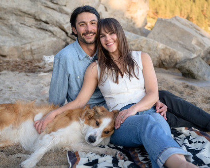 posed engagement photo cuddling with dog on Tahoe East Shore
