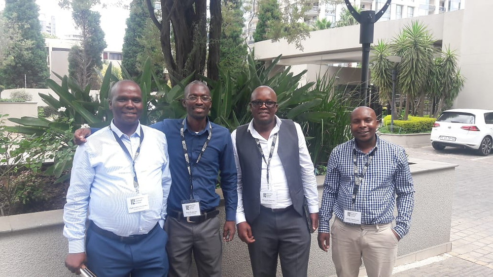 Dumalisile Comprehensive High School Principal, Mr Ncebetha, Itayi Nyakudya (Axium Education Specialist: InterSenior), Zwenlinzima SPS Principal Mr Ntshonga and Jacob Junior Chirumanzi (Axium Education Specialist: FET).