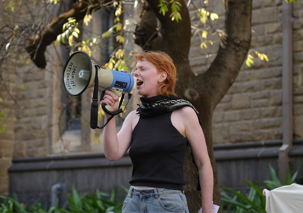 Gemma Seymour, a Students for Palestine and RMIT Socialists member, at the snap rally on Thursday. (Credit: Jessica Djendria)