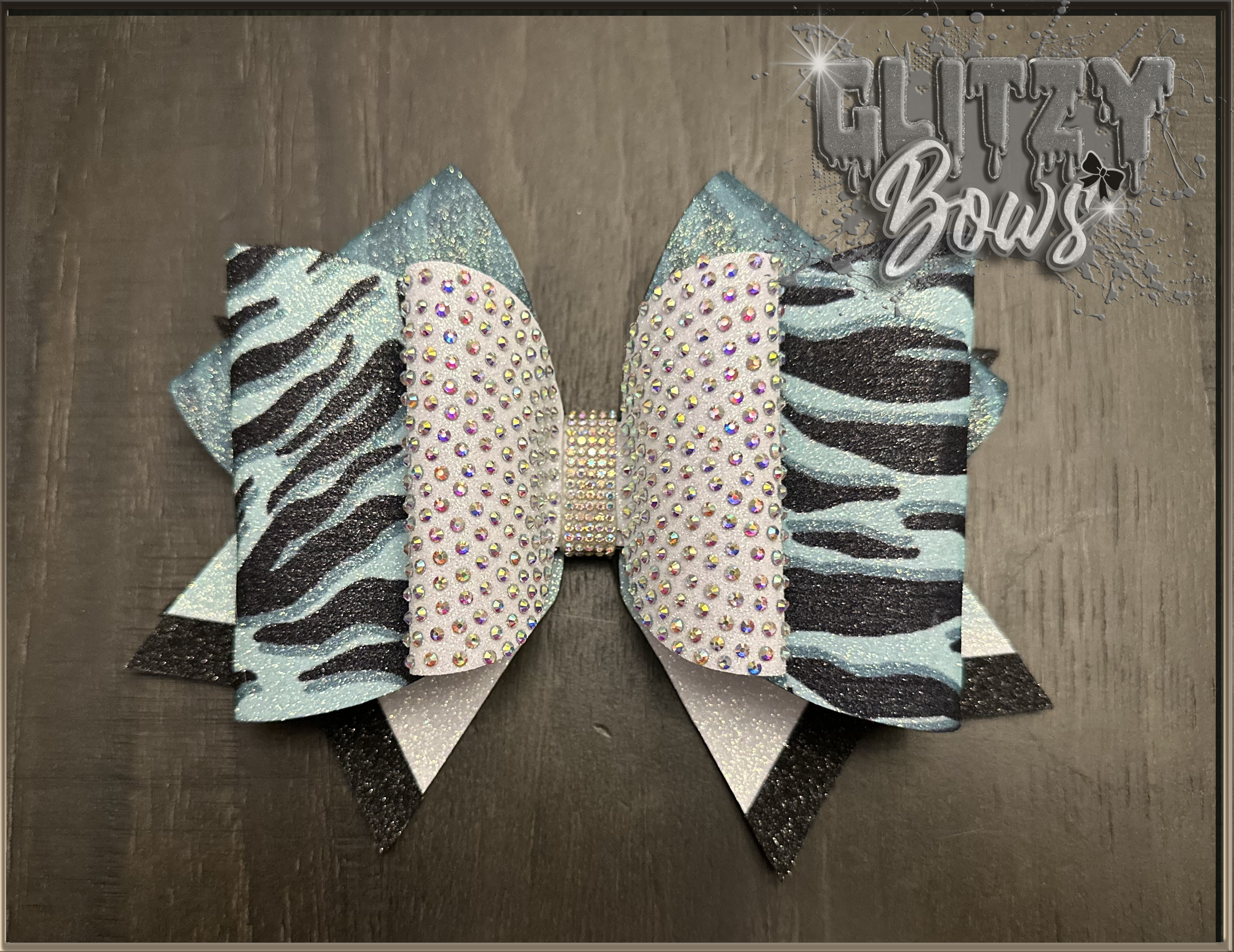 Teal, black, and white tiger striped Triple Threat Bow