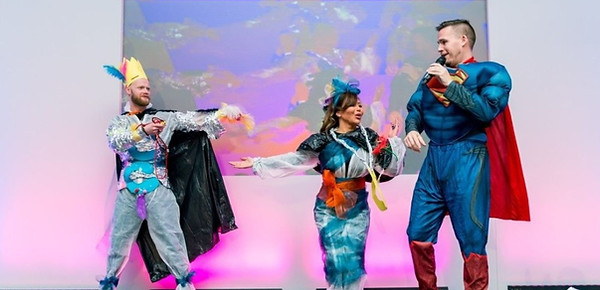 Superman event emcee Simon Howard hosting a super hero team building experience for a corporate event