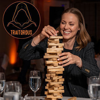 A woman doing a table based chalenge while competitng in Traitorous the traitors themed party experience