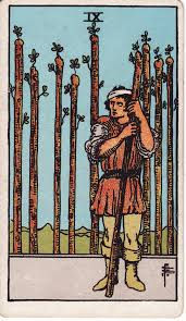 The Nine of Wands — From Trauma to Triumph
