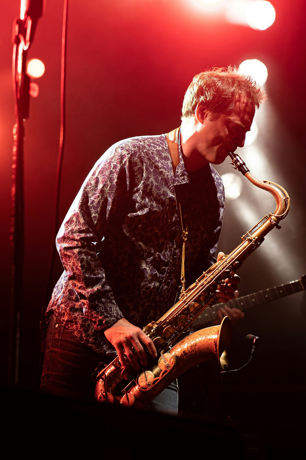 Live saxophonist performing at a corporate event in Cairns