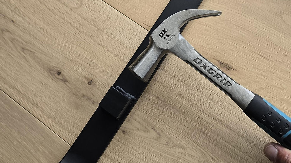 Imperial Flooring Pulling Iron in action, demonstrating its role as a crucial tool for precise timber floor laying.