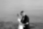 wedding couple embracing in front of the sea