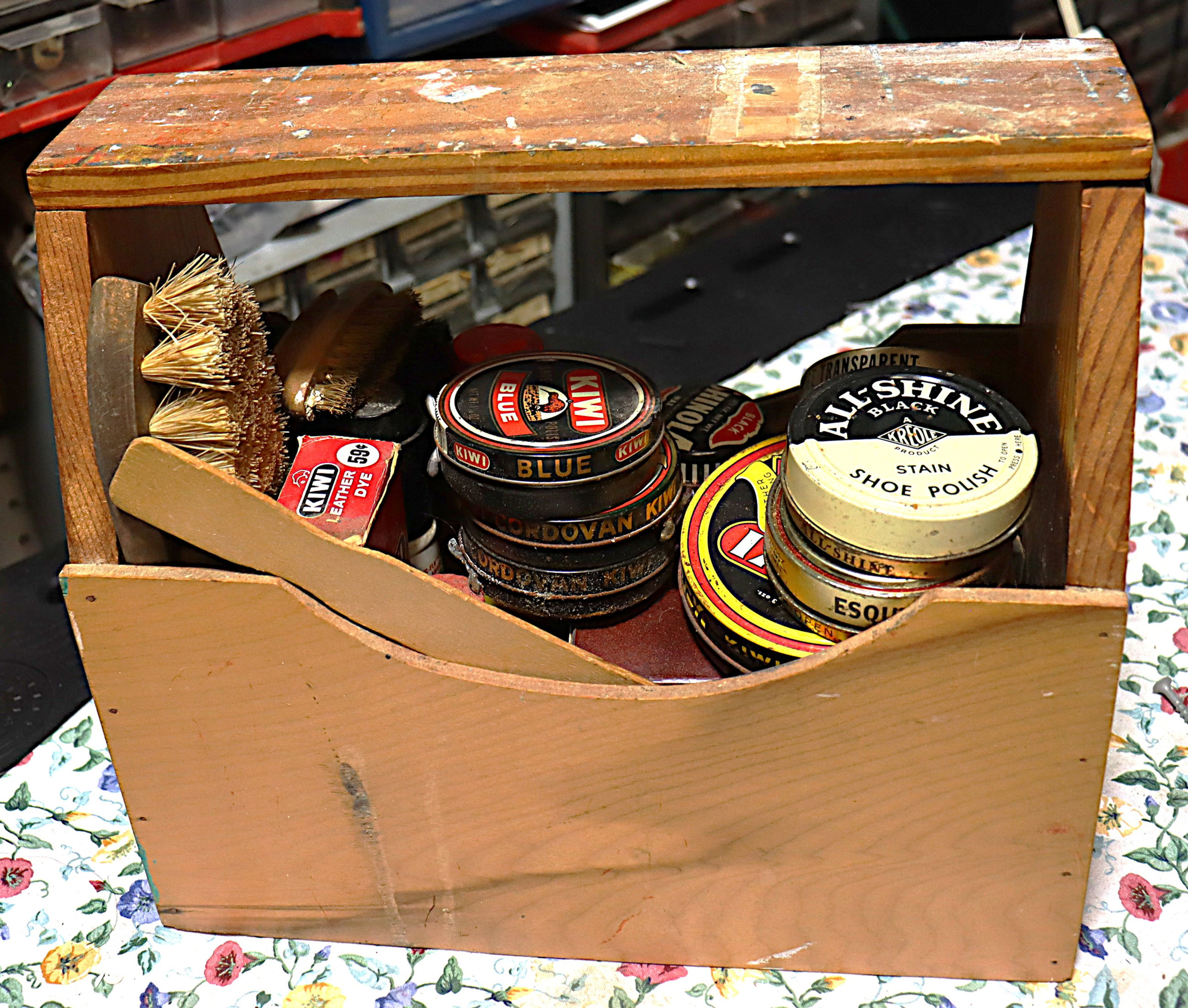 Vintage wood shoe shine kit with 4 brushes and 12 polish cans and polish contai
