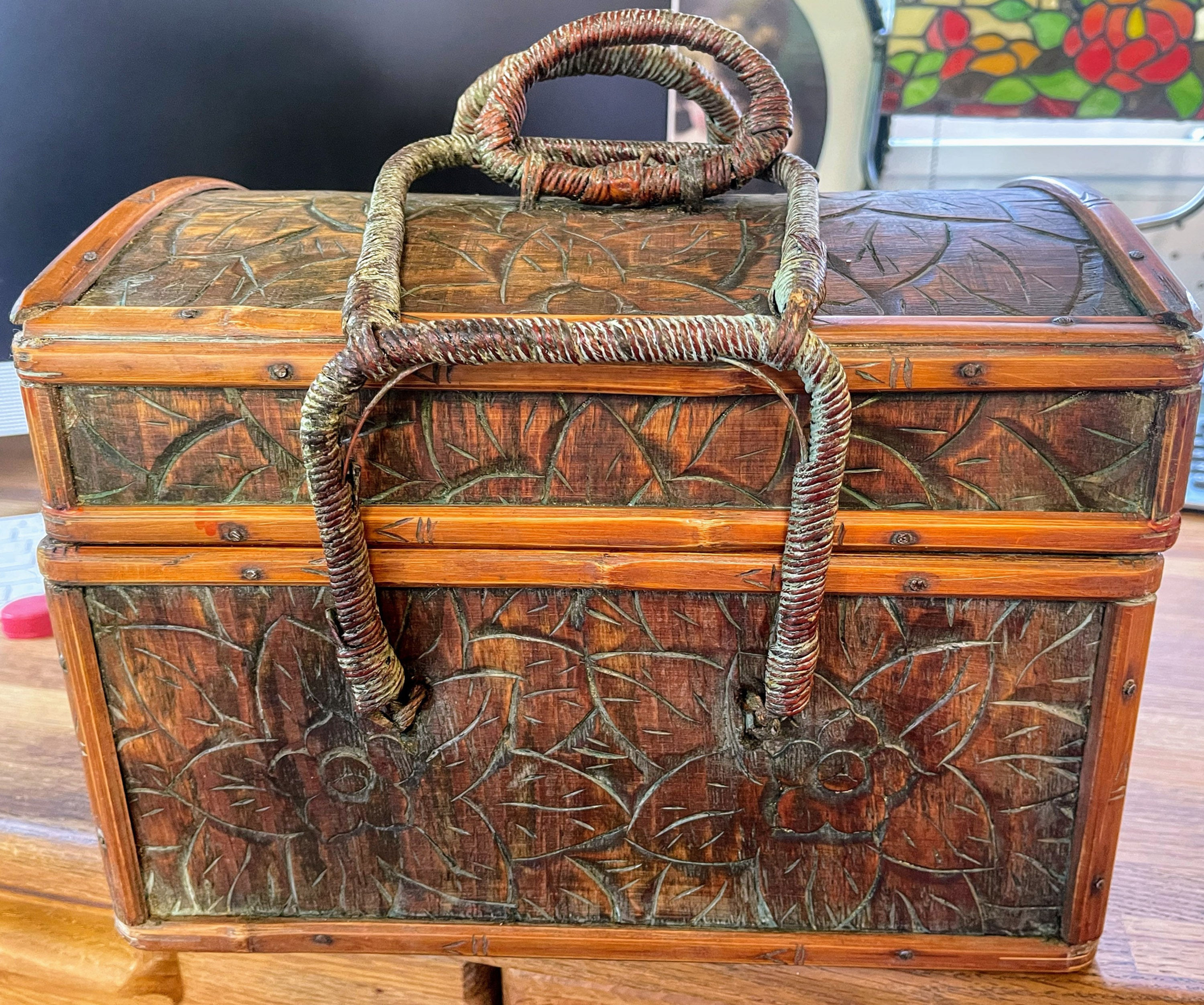 Vintage carved leather and wood basket