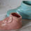 Thumbnail: Vintage set of 2 ceramic baby shoes