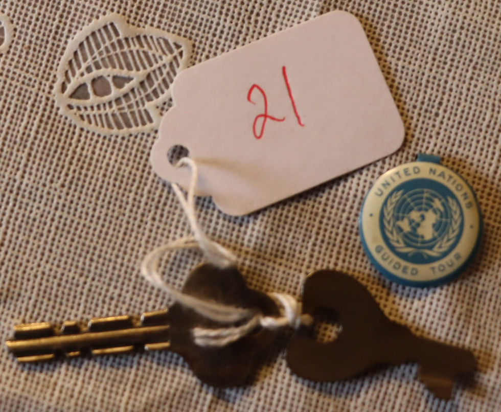 2 vintage keys and a vintage United Nation tour badge