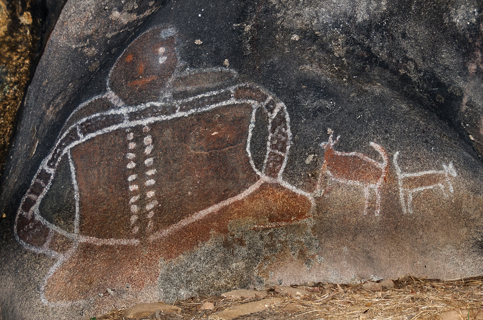 a-rock-with-a-painting-of-a-man-and-a-dog-on-it