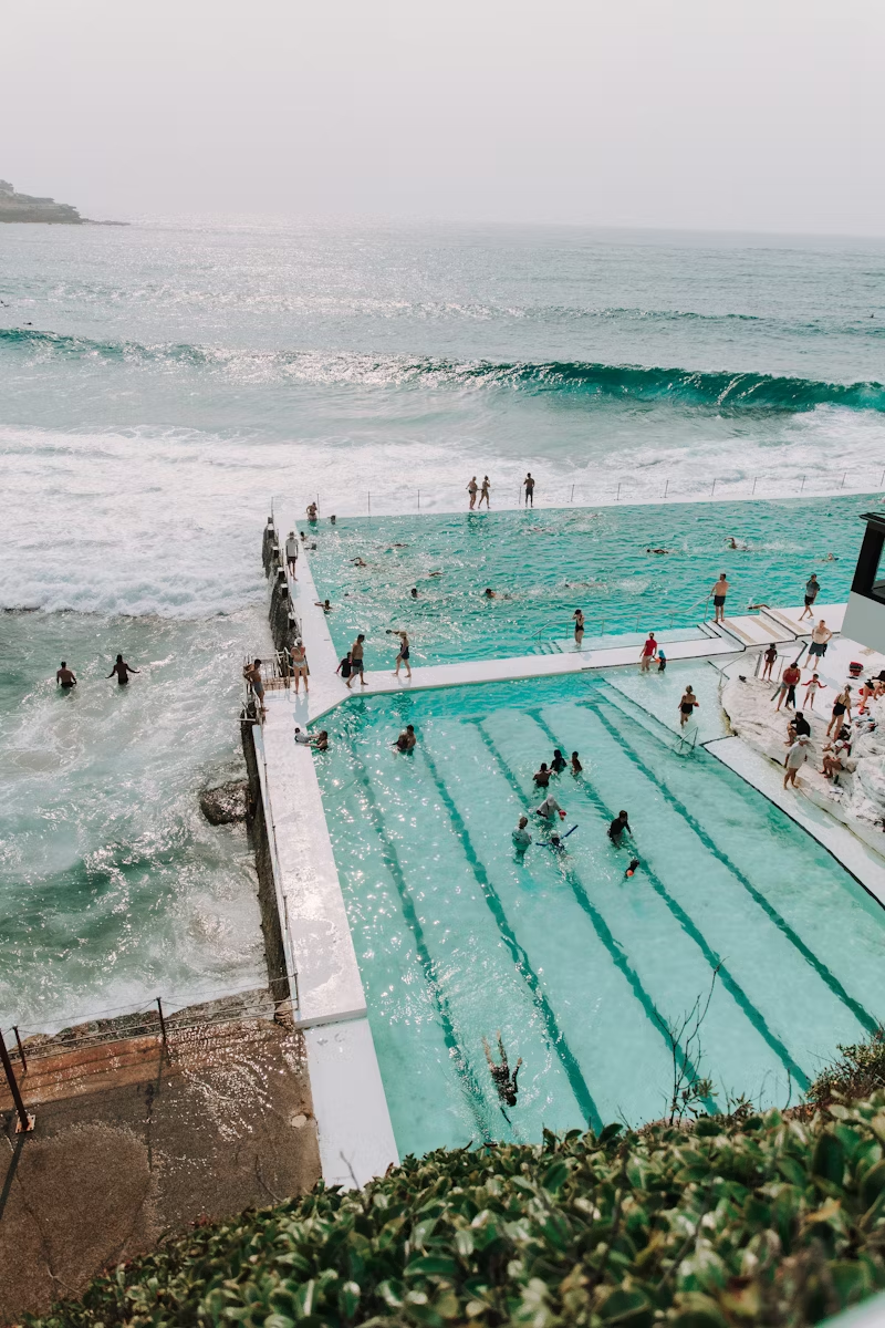 people-swimming-on-pool-near-sea