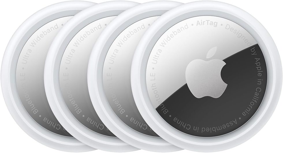 Four overlapping Apple AirTags, silver with white edges, display text "Ultra Wideband" and "Designed by Apple." Clean, modern design.