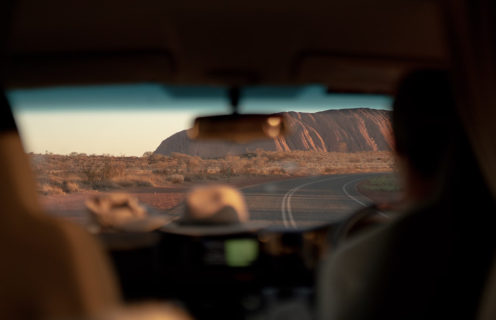 person-driving-car-on-road-during-daytime