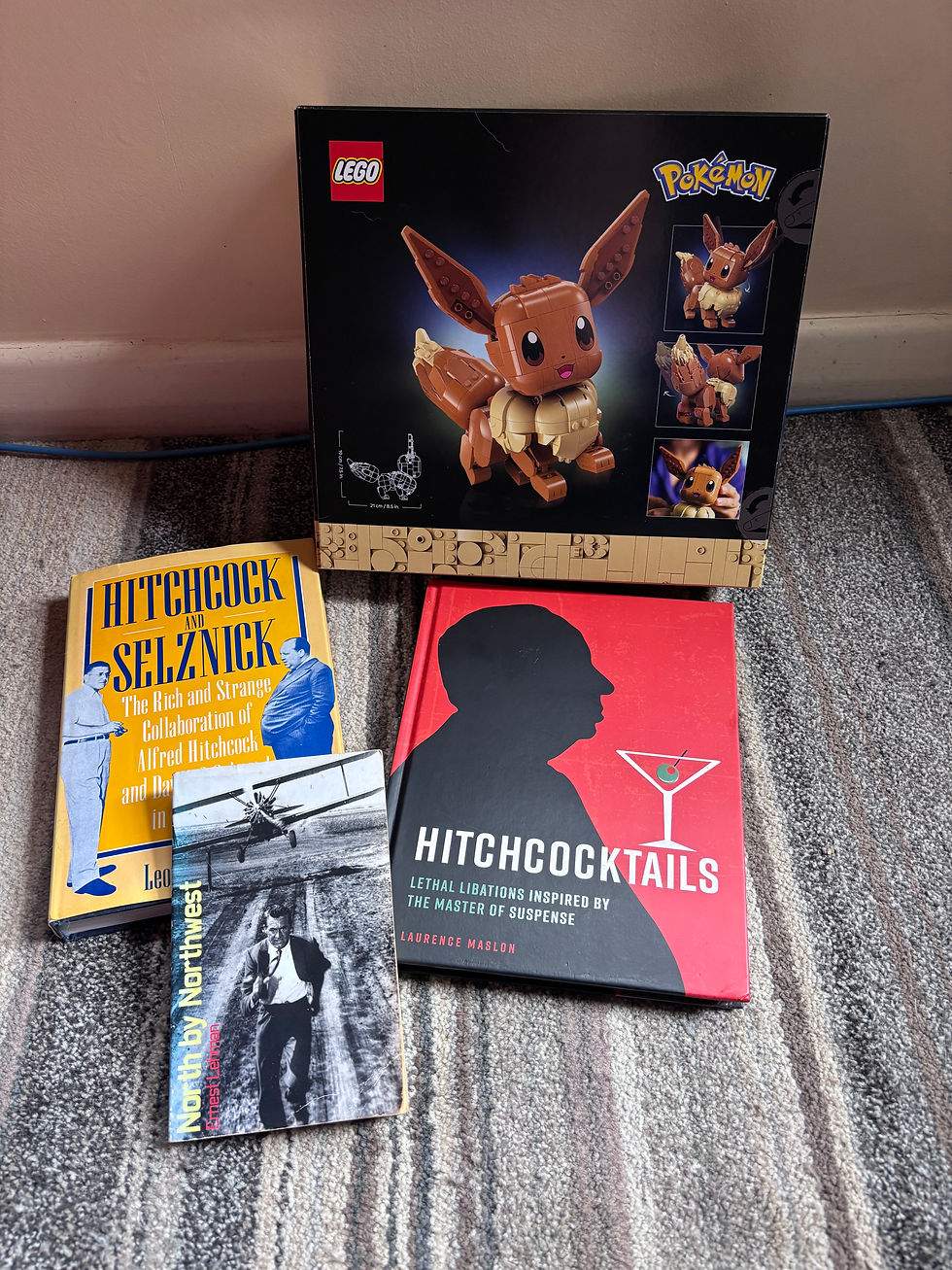 A lego Eevee and various Alfred Hitchcock related books, a gift from a dinner date client of Gemini Rose, an escort  in Wellington, New Zealand.