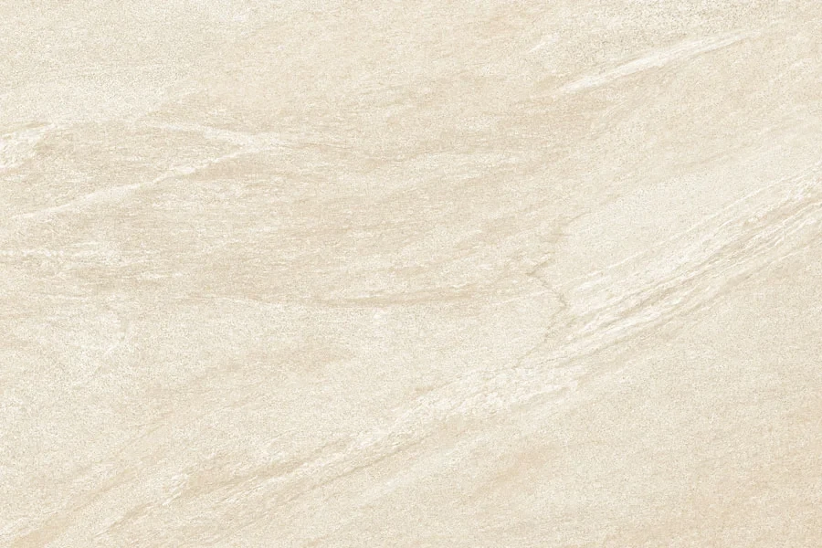 Warm beige porcelain paving slabs reflecting soft natural sunlight