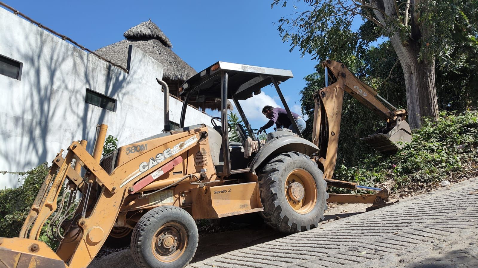 Backhoe working on NAYARI construction access in February